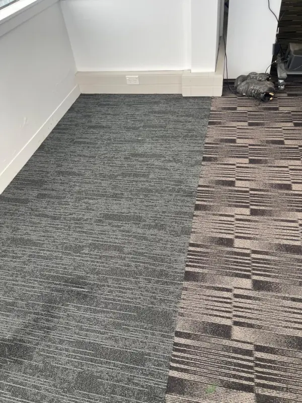 Same corner with new patterned carpet tile installed