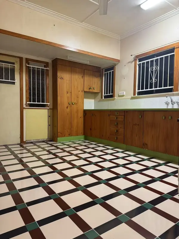 Kitchen with new black and white patterned tile flooring
